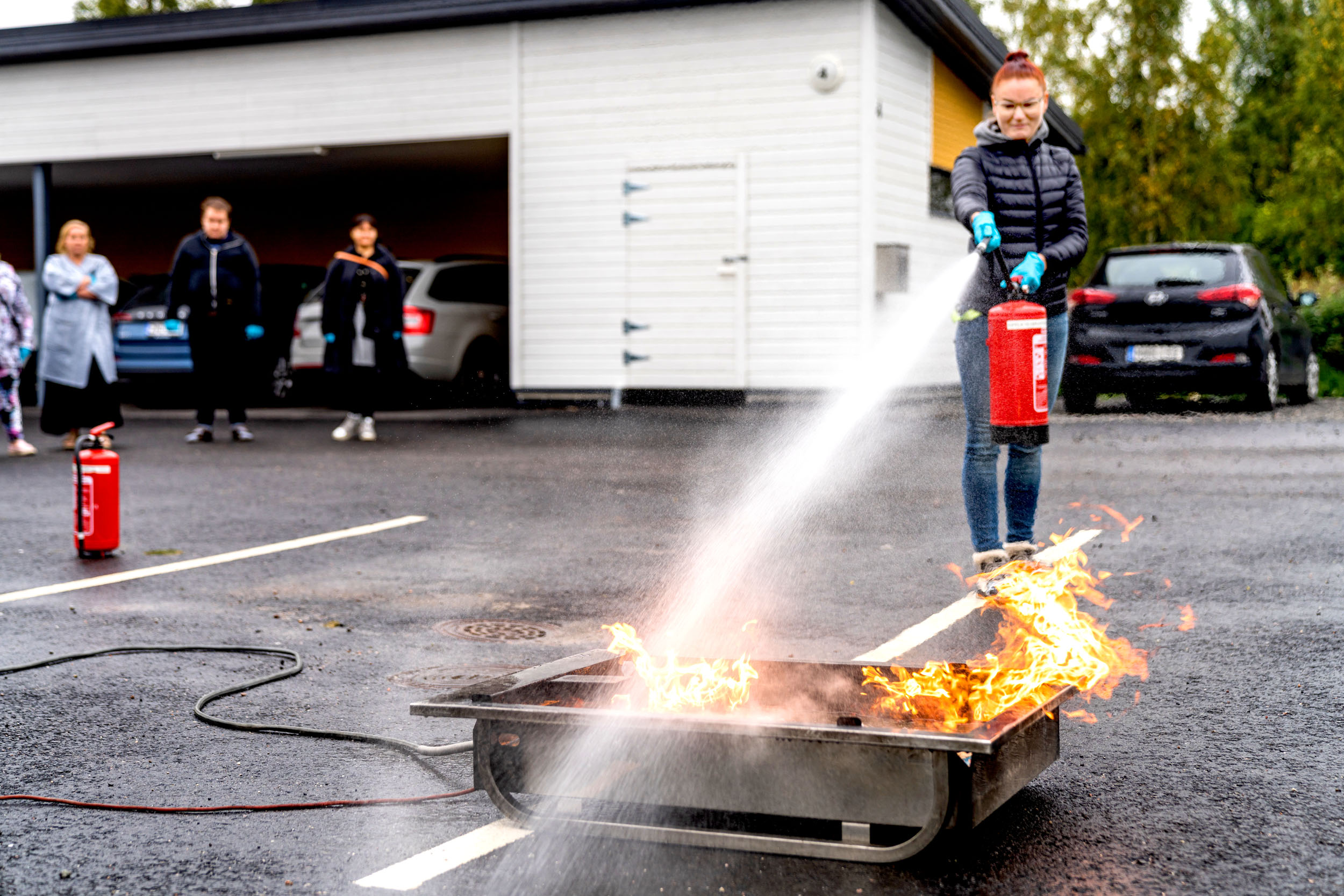  Trainee using a fire extinguisher 