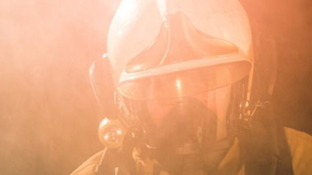  Firefighter in smoke. Picture shows head and helmet. 